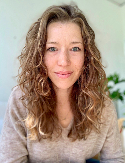 A curly blonde hair woman.