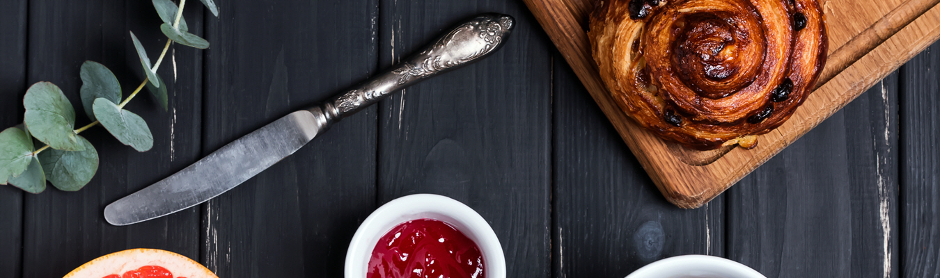 a bowl of jam and a spoon