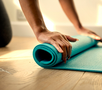 Hand folding a mat
